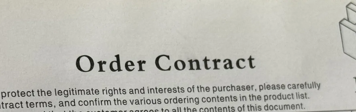 A Juhaus order-contract form with its filled fields obscured.