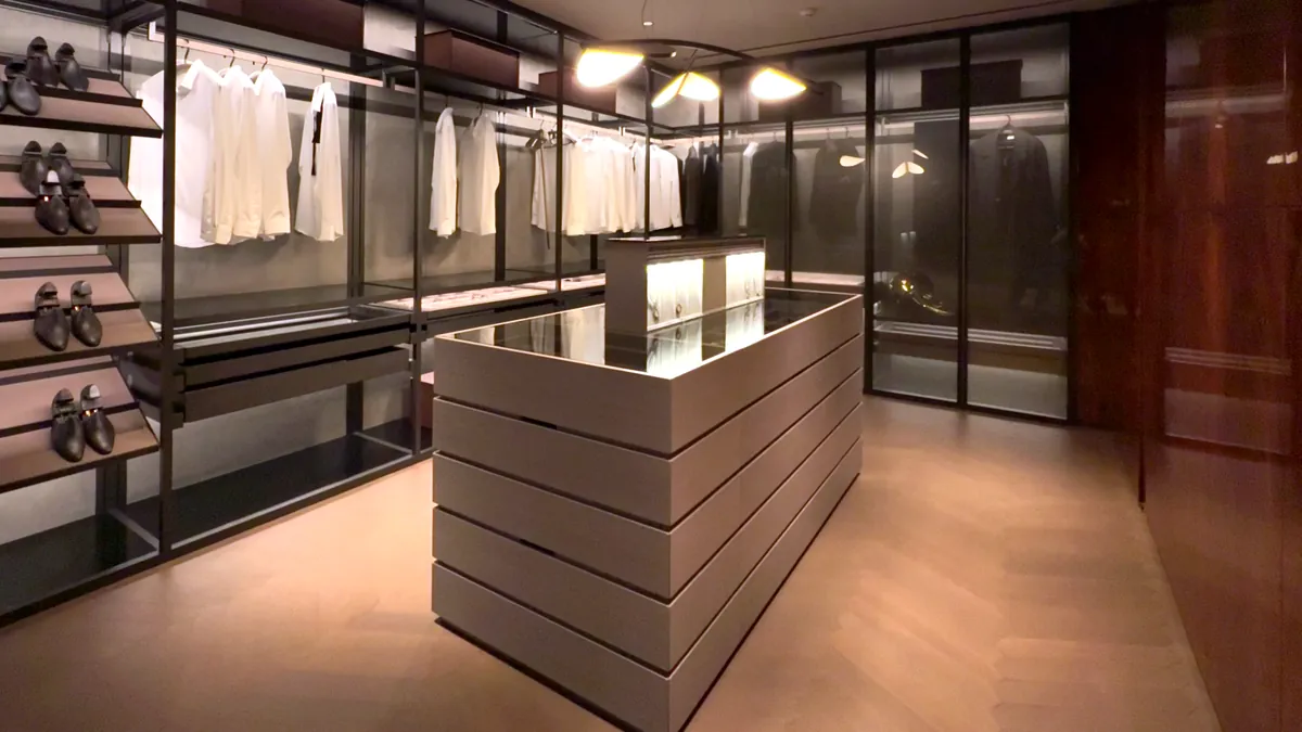 A fitted cabinetry display with warm timber finishes.