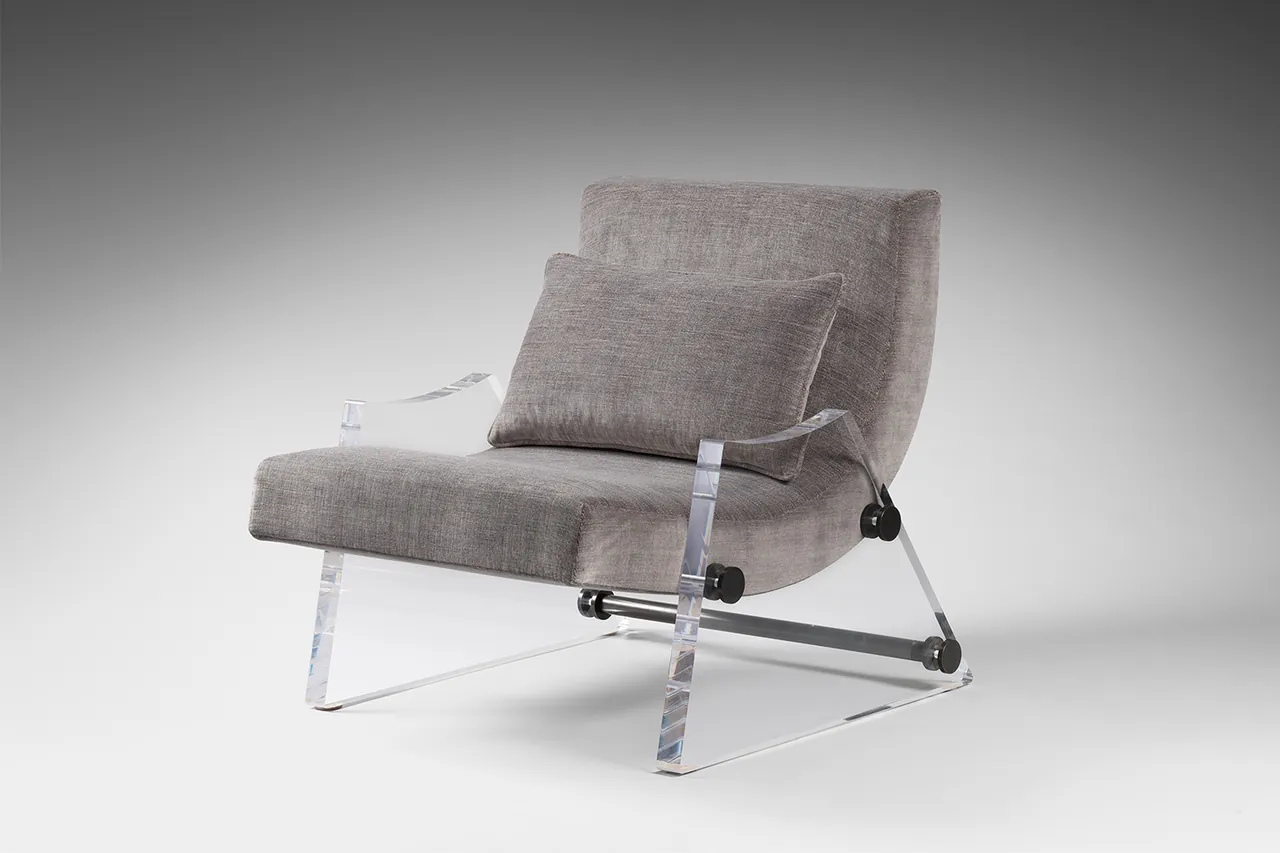 A grey upholstered seat and backrest on a clear-sided frame, photographed or rendered against a grey gradient background.