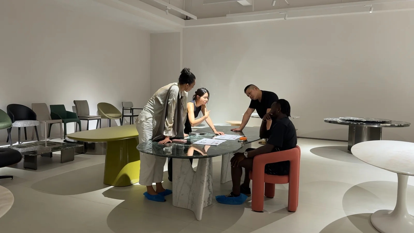 Clients and advisers compare printed options around a table.